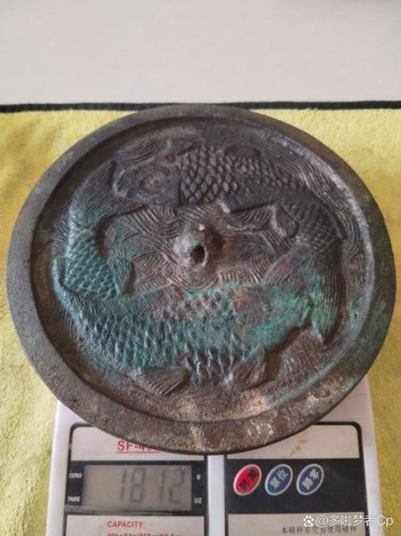 辽代双鱼镜价格_辽代双鱼镜真伪鉴别